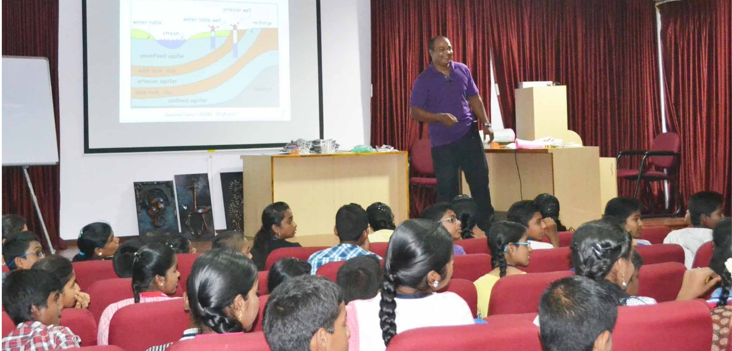 APSCC resource person leading a session on groundwater and environmental science for school students at the Summer Vacation Science Camp, Puducherry